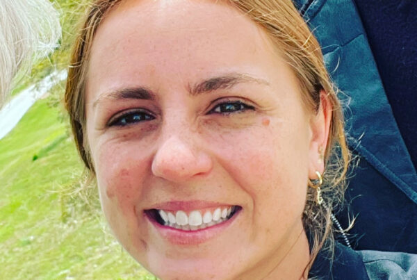 headshot of a smiling white woman